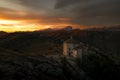 Ancient church among mountains under a beautiful sunset Royalty Free Stock Photo